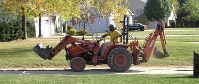 heavy machinery driving over protected grass